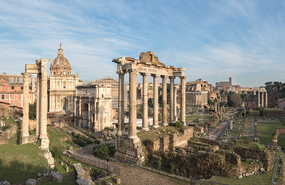 Cityscape of the Roman Forum ruins with the Arch of Severus, temple of Saturn, temple of Vesta, Basilica of Maxentius, Arch of Titus and Colosseum in Rome, Italy
